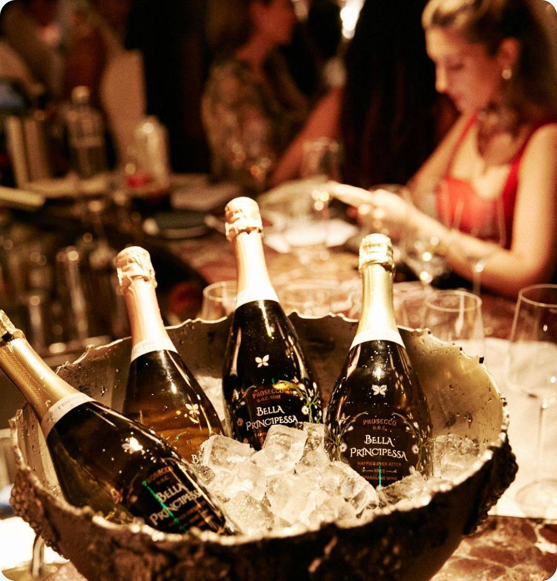 Bella Principessa Prosecco bottles chilling in an ice bucket at a bar